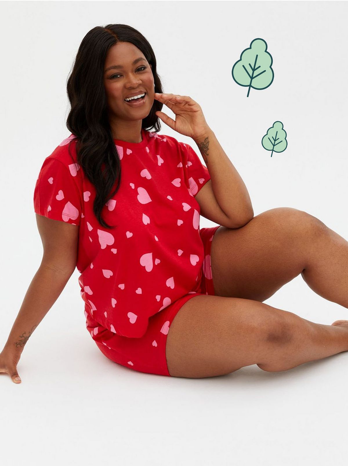 Woman wearing a red heart t-shirt and shorts pyjama set