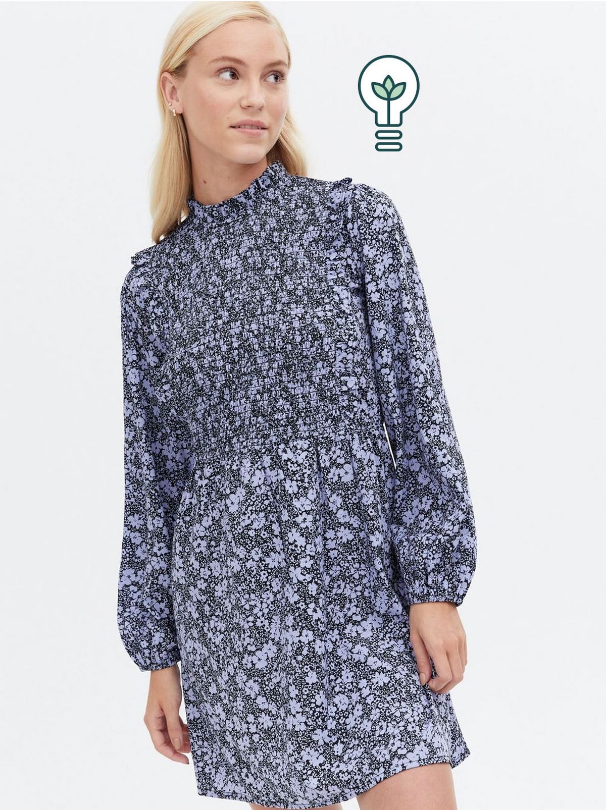Woman wearing a blue floral high neck mini dress