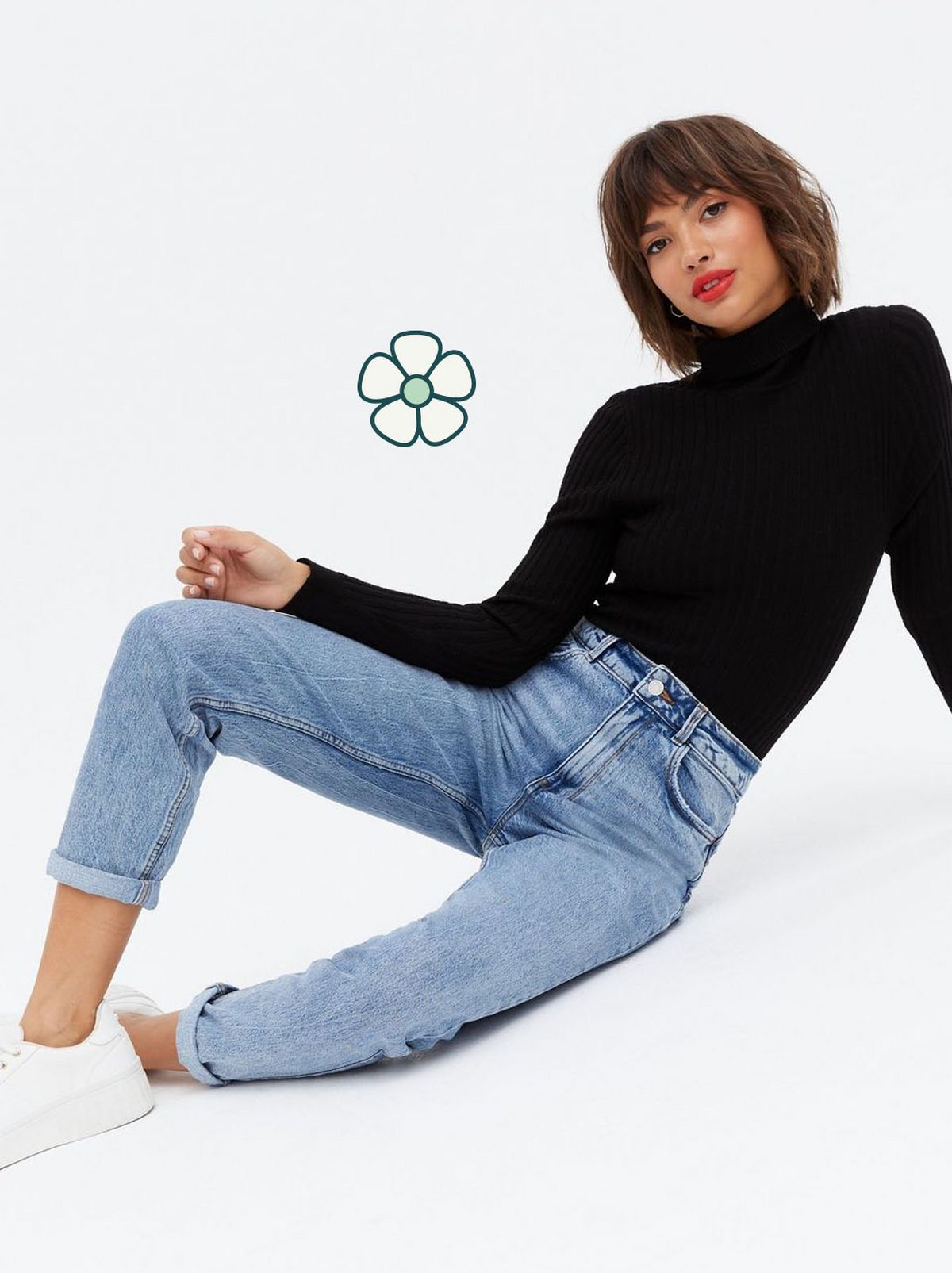 Woman wearing blue mid waist mom jeans