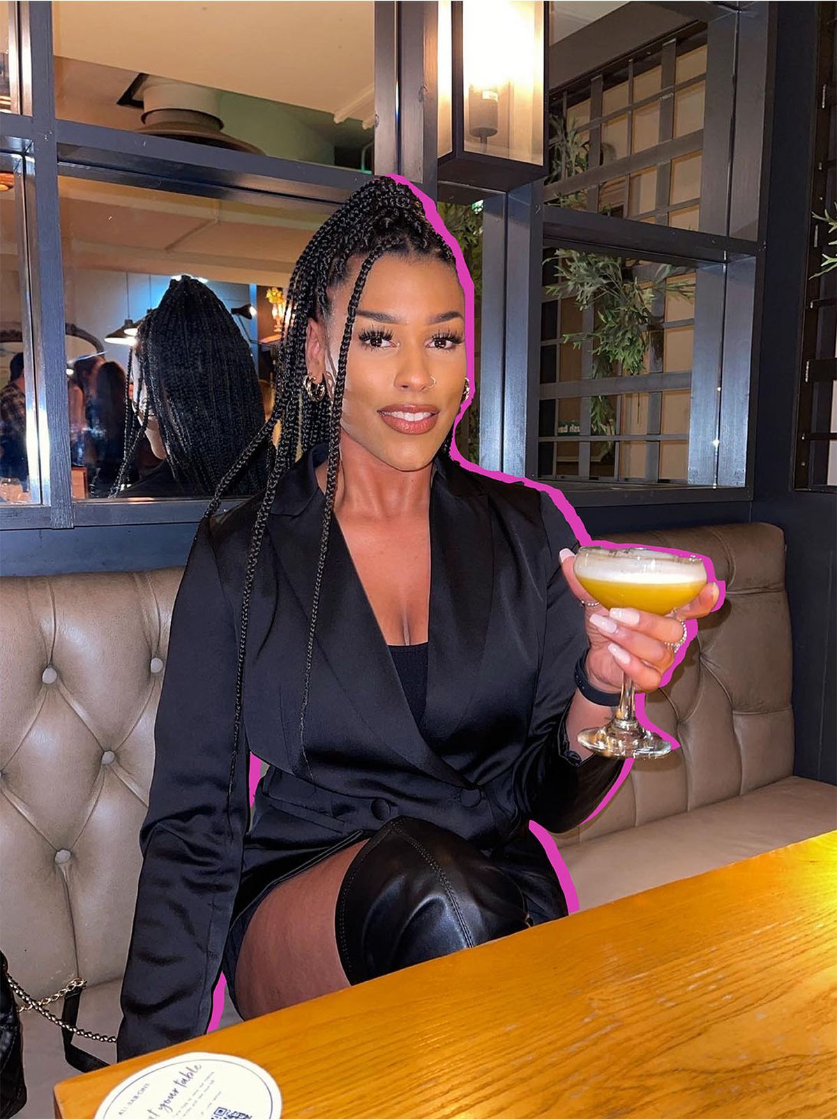 Jasmine wearing a black mini dress	