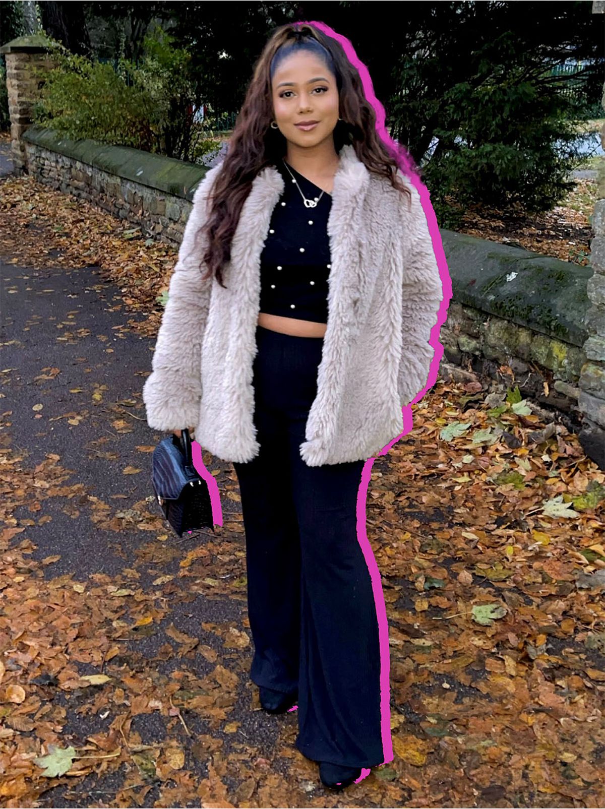 Shanuja wearing a teddy fur cream coat	