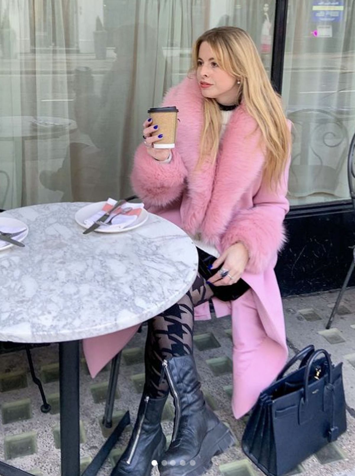 Em la petite française wearing a pink faux fur long coat	
