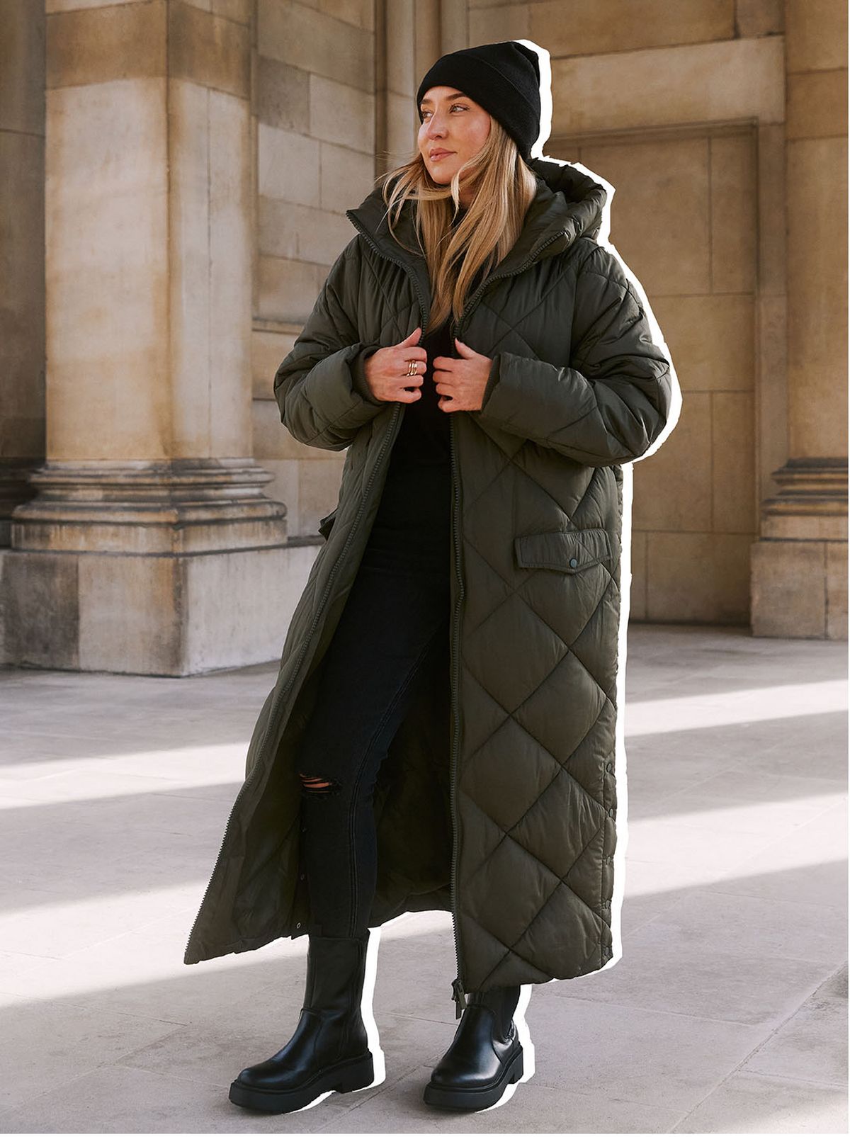 Freya Killin wearing a long padded coat