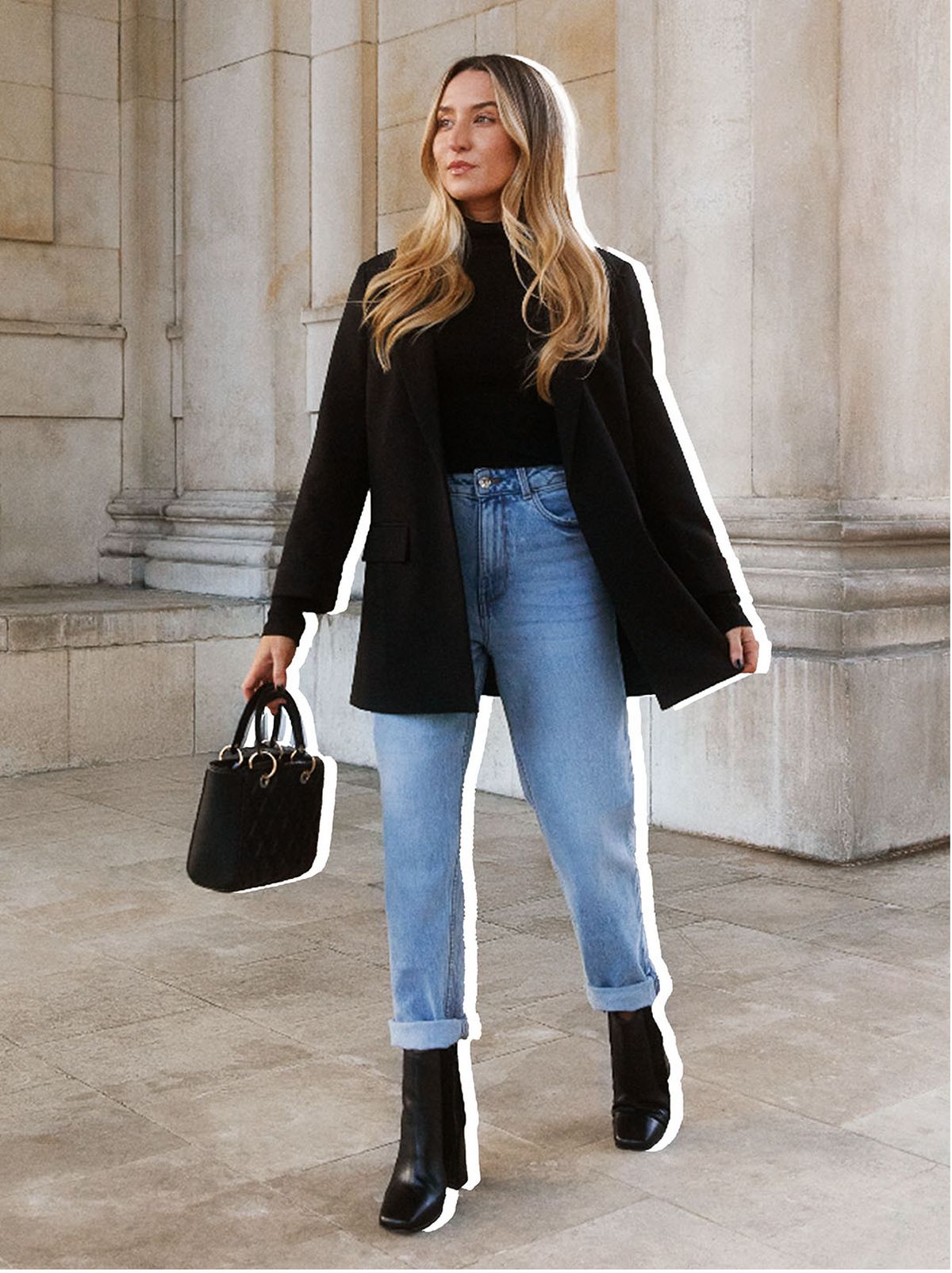 Freya Killin wearing a black coat and jeans