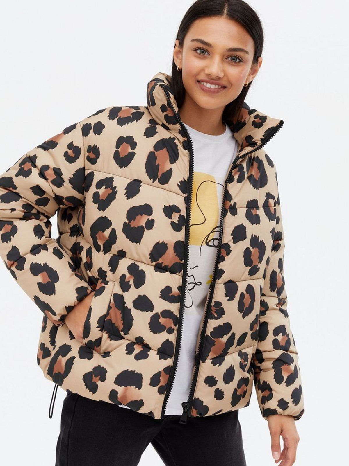 Woman wearing a brown leopard print puffer jacket