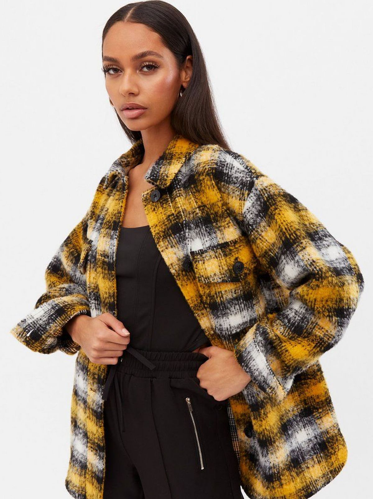 Woman wearing a mustard check brushed shacket