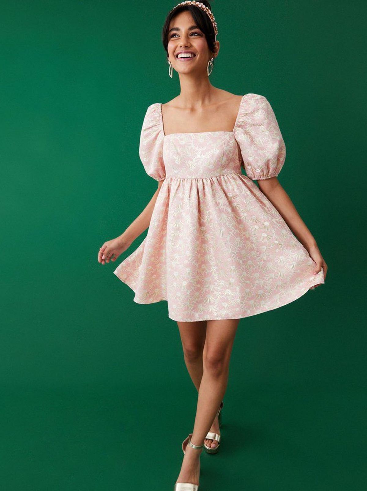 Woman wearing a pink floral babydoll dress