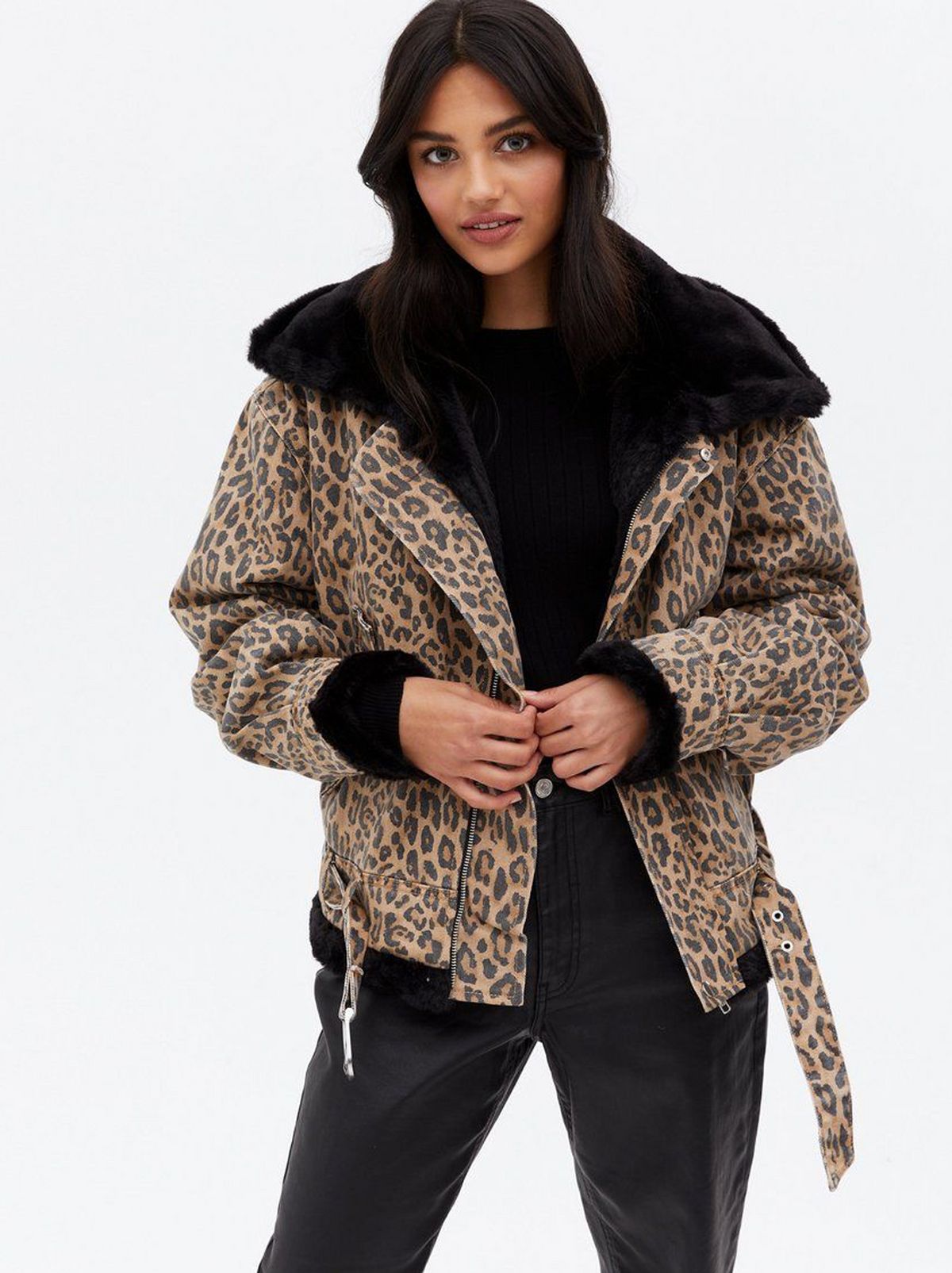Woman wearing a brown leopard print aviator jacket
