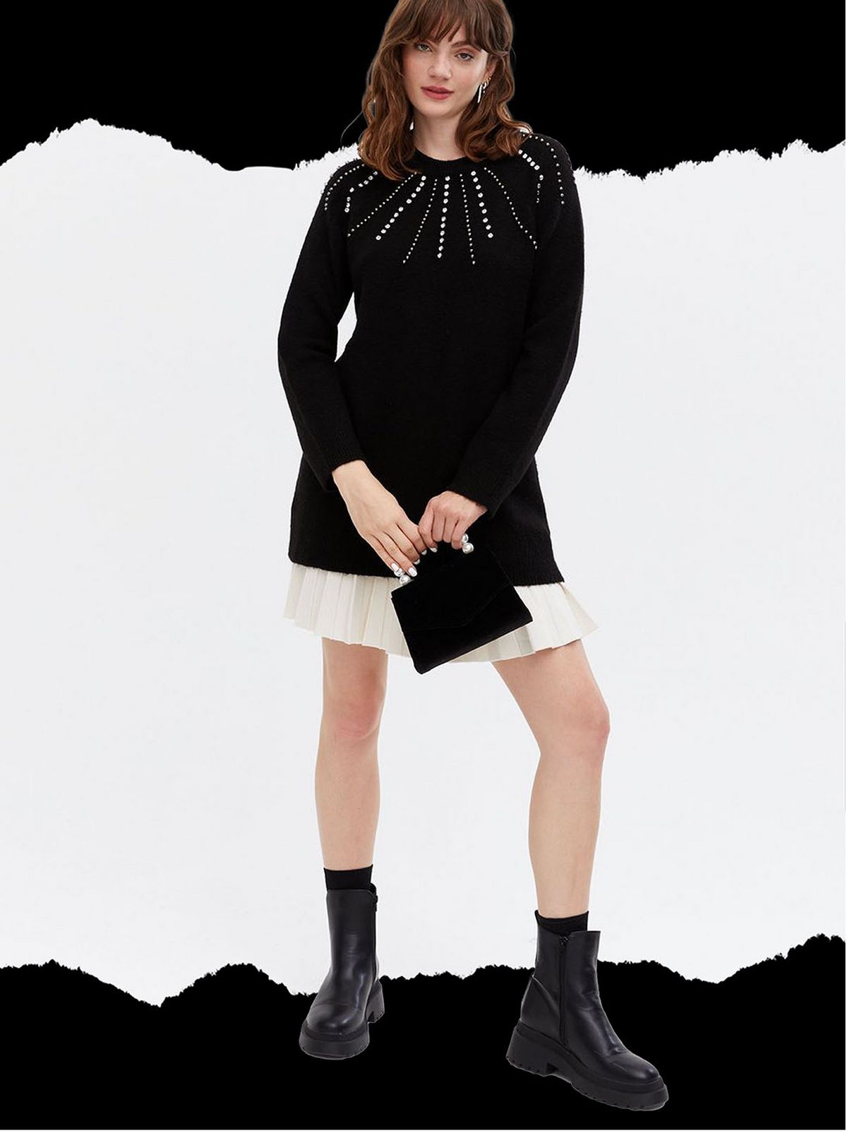 Woman wearing a black diamanté long jumper