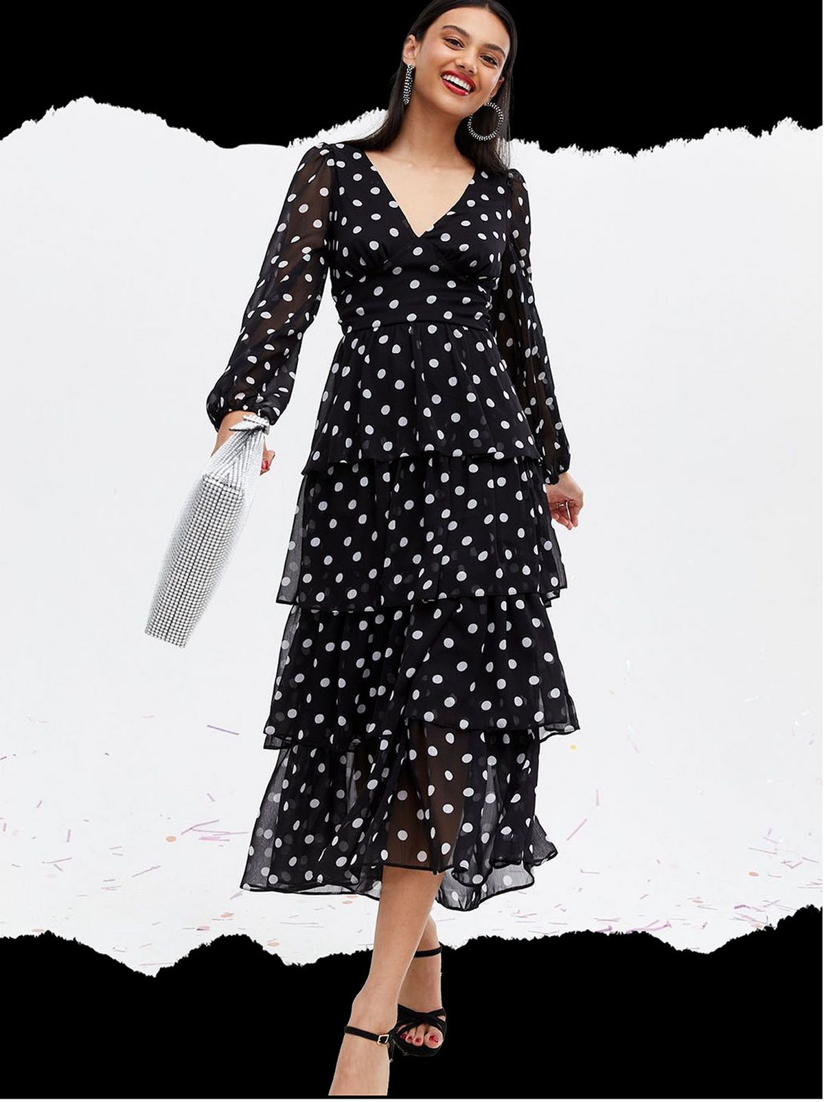 Woman wearing a black chiffon white dot dress
