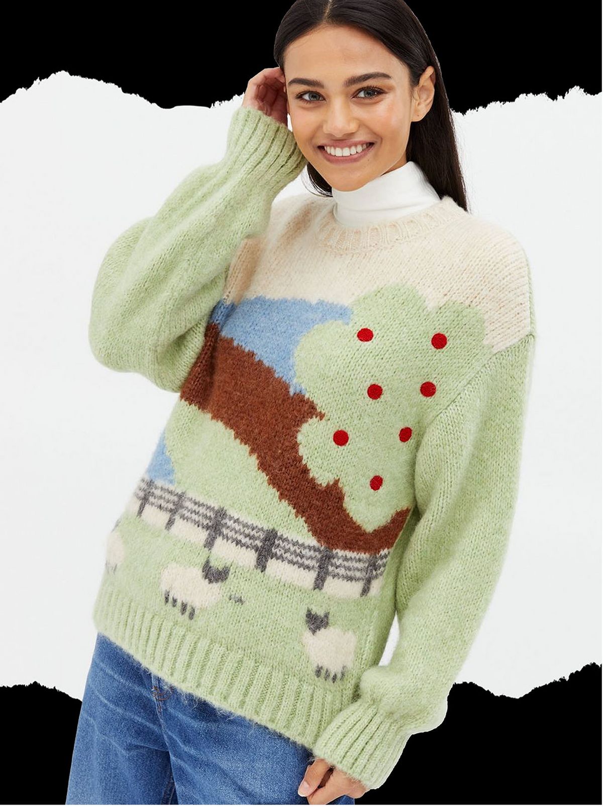 Woman wearing a cream farmyard knit jumper