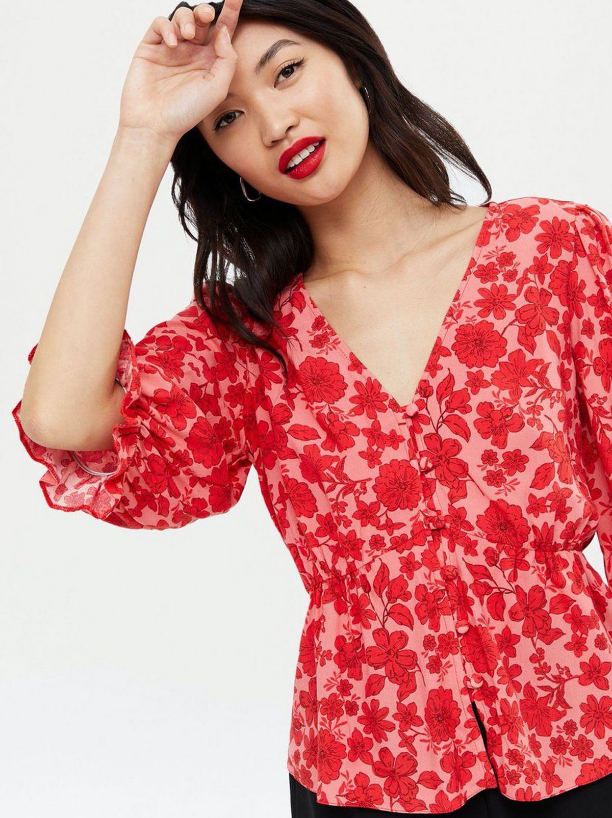 Woman wearing a Red Floral Print Blouse