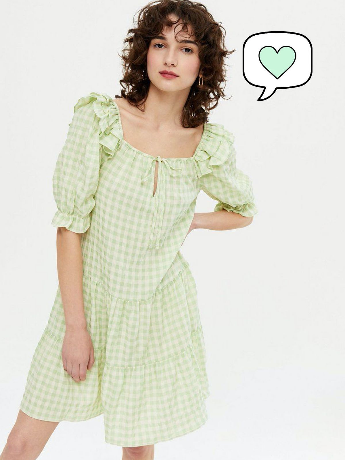 Woman wearing green gingham square neck smock dress