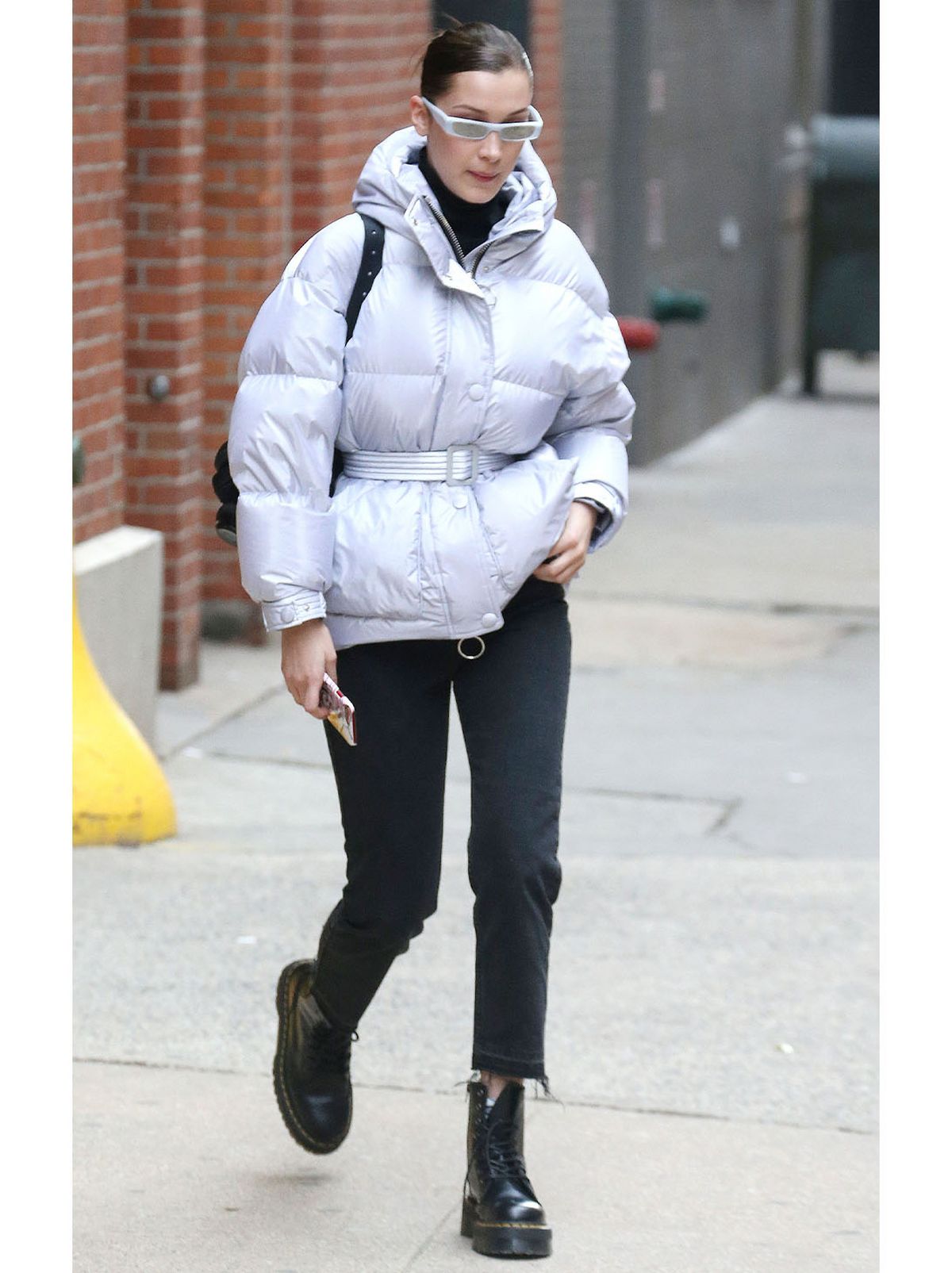 Bella Hadid wearing chunky boots with a puffer coat