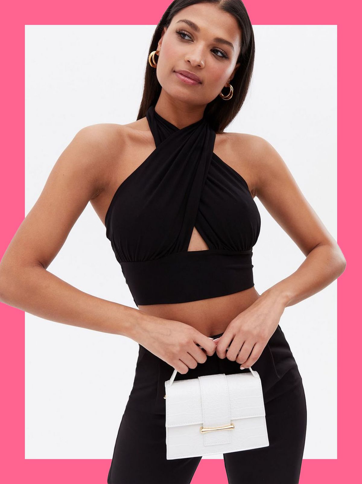 Woman wearing faux croc top handle mini crossbody bag