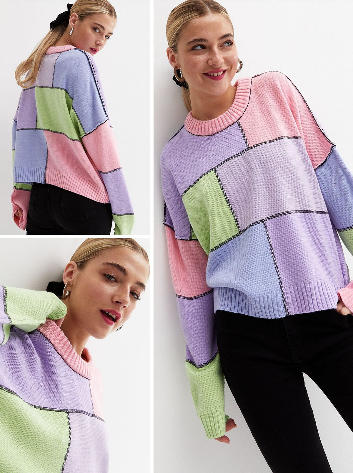 A woman standing and wearing a multicoloured patchwork jumper and black trousers