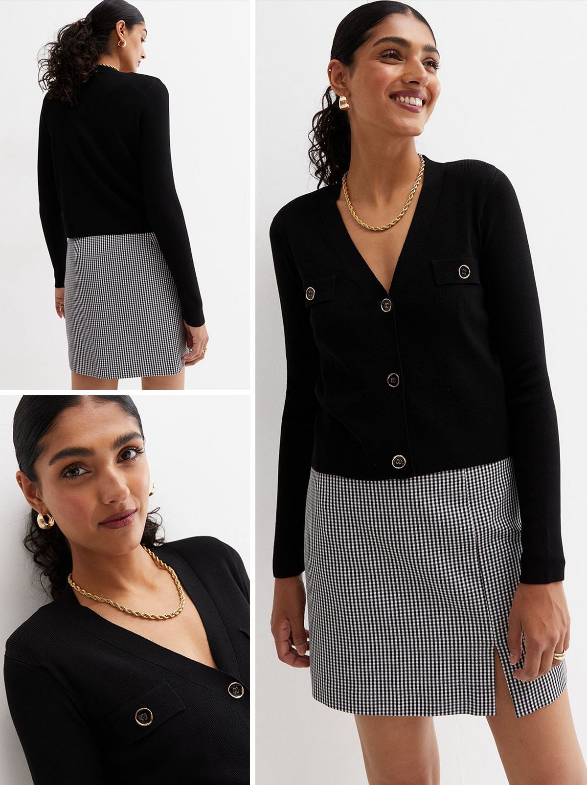 A woman standing and wearing a black v neck cardigan and black and white skirt