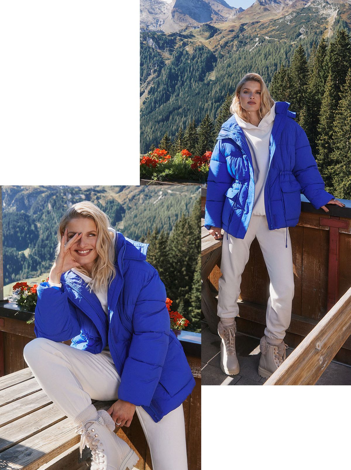 A model leans on a glass wall with a dramatic forest behind them, wearing a bright blue puffer jacket and an all-white outfit of a hoodie, trousers and some cream boots