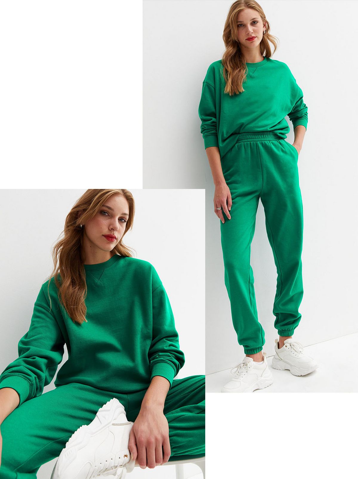 A model sits on a white chair in front of a white background looking at the camera with one leg tucked in front of her, she wears a pair of white trainers and a green crew neck sweatshirt and a pair of matching tracksuit pants