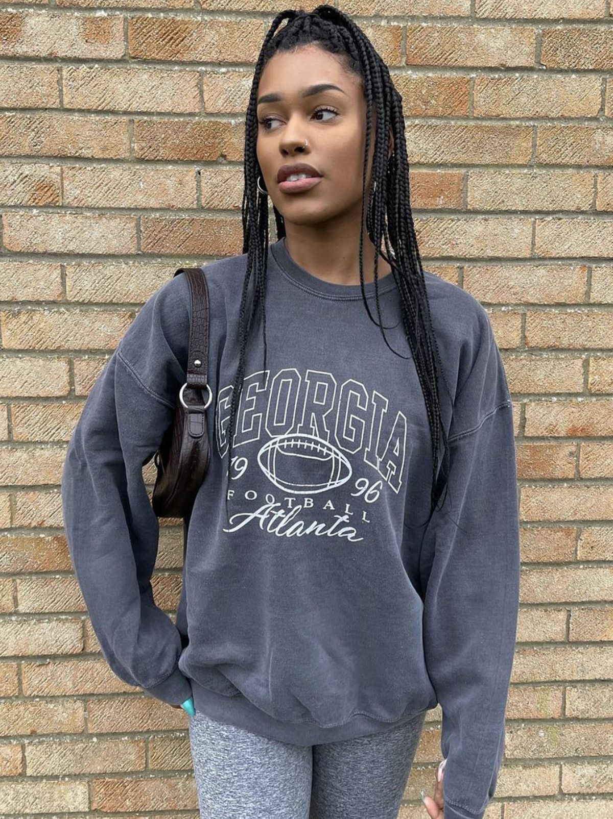 New Look's Jasmine wearing grey leggings  and grey jumper