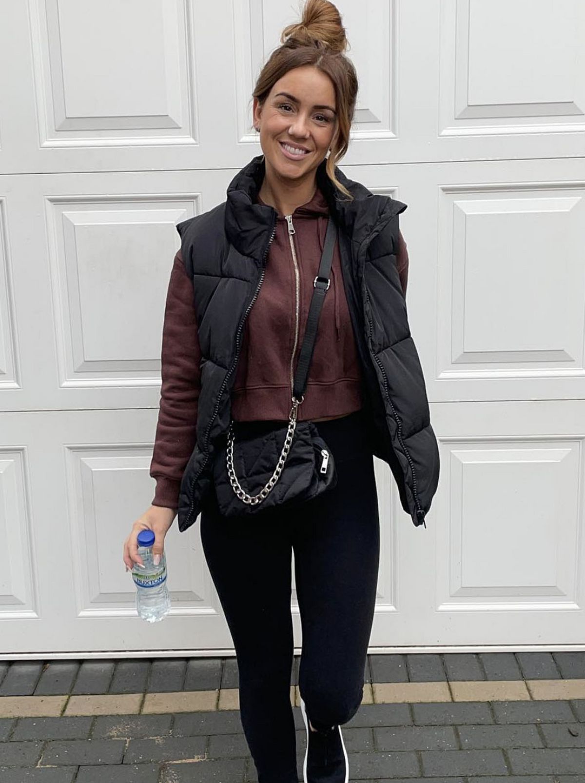 New Look's Laura K wearing a black sleeveless puffer jacket and black leggings