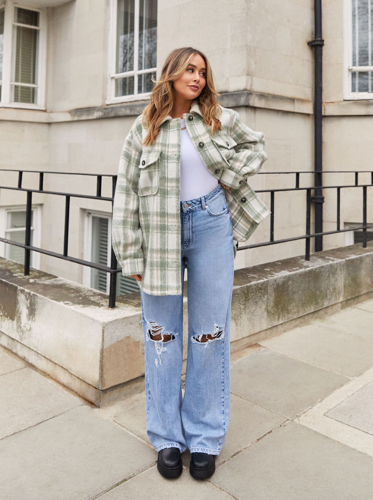 Sophie Milner wearing a New Look shacket, top and wide leg jeans