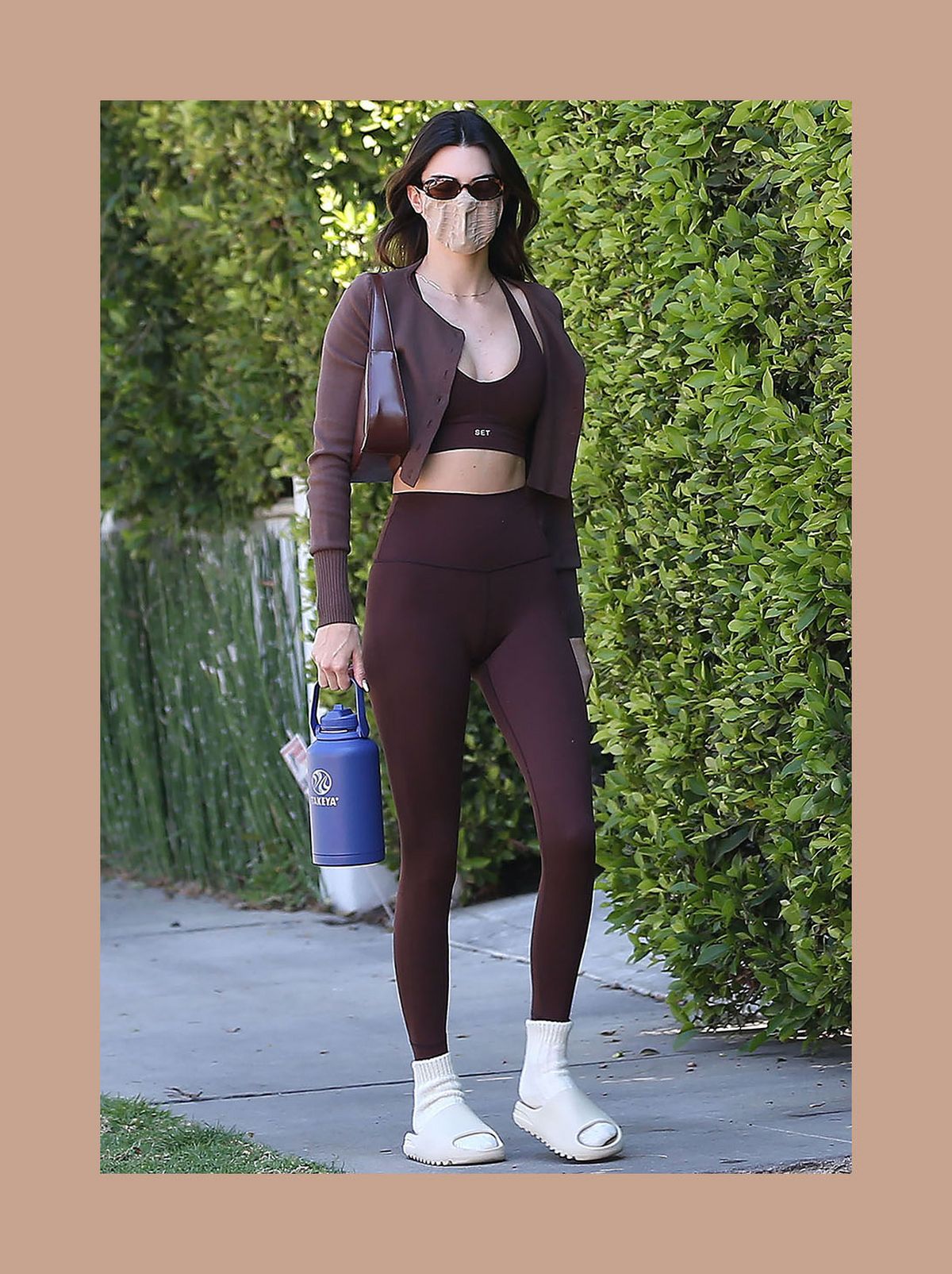 Kendall Jenner wearing brown leggings and sports bra set