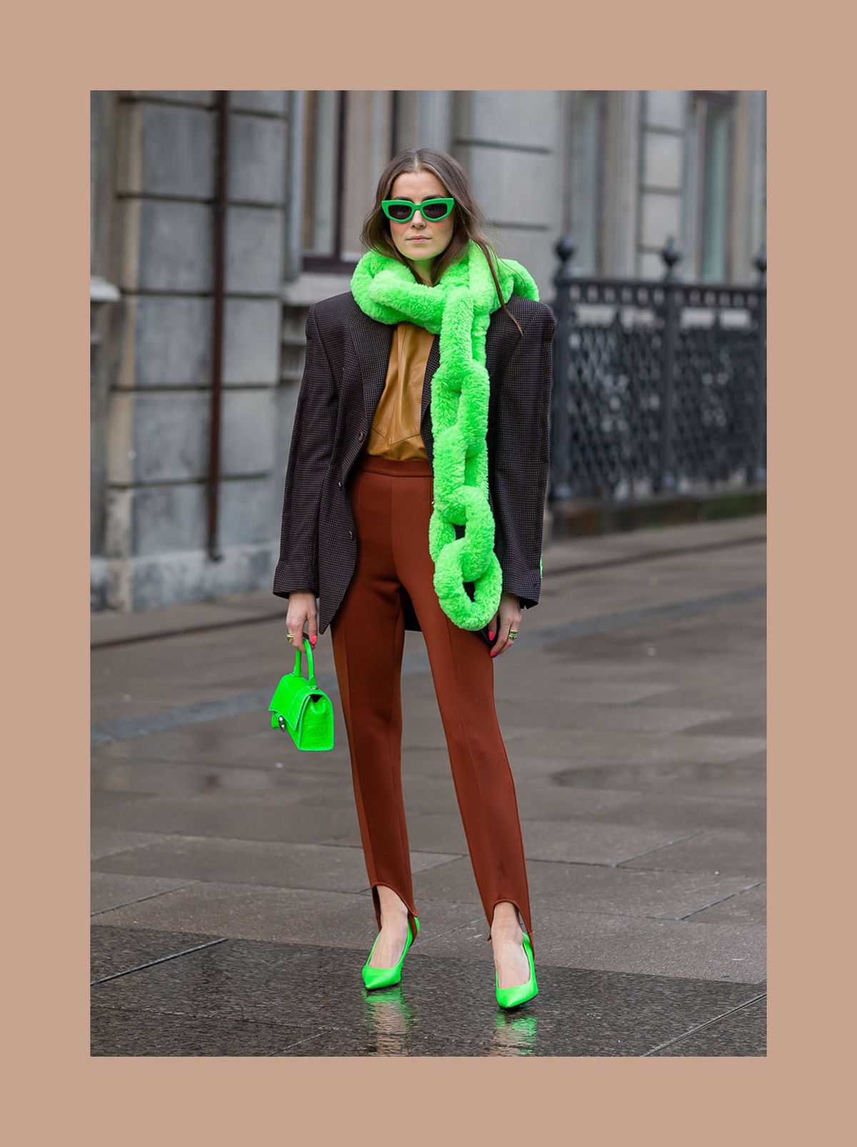 Nina Sandbech wearing a neon green scarf and brown pants