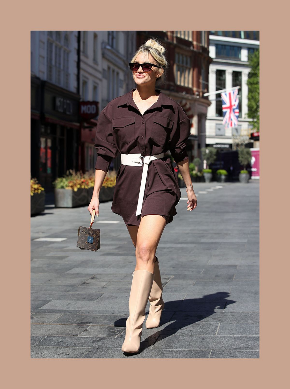 Ashley Roberts wearing a brown mini shirt dress