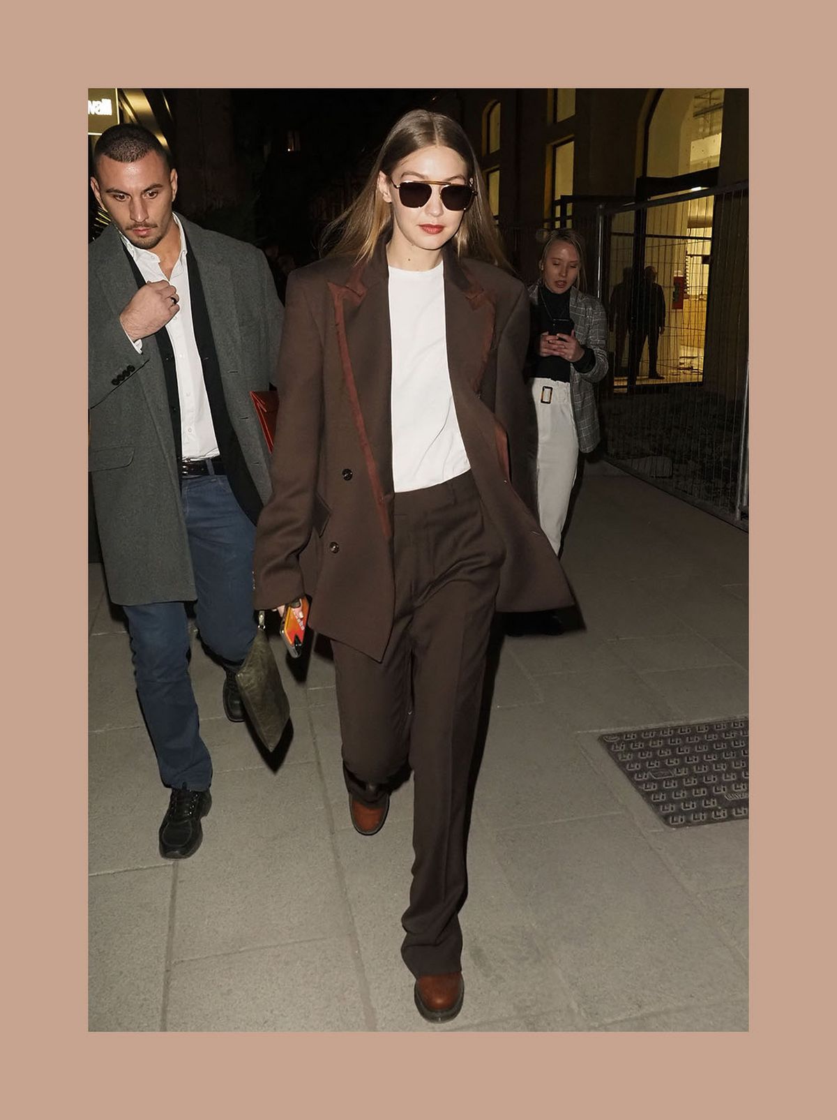 Gigi Hadid wearing a brown blazer and pants co-ord set