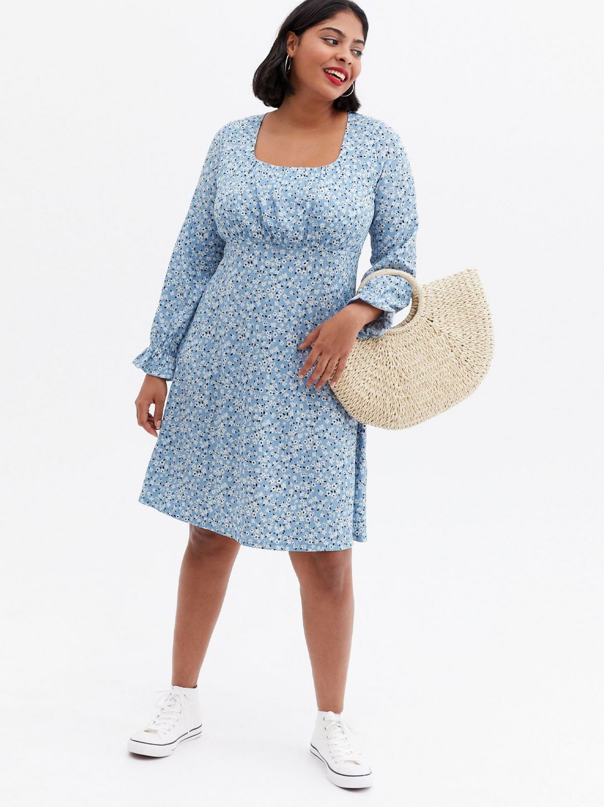 Woman wearing a blue floral square neck mini dress