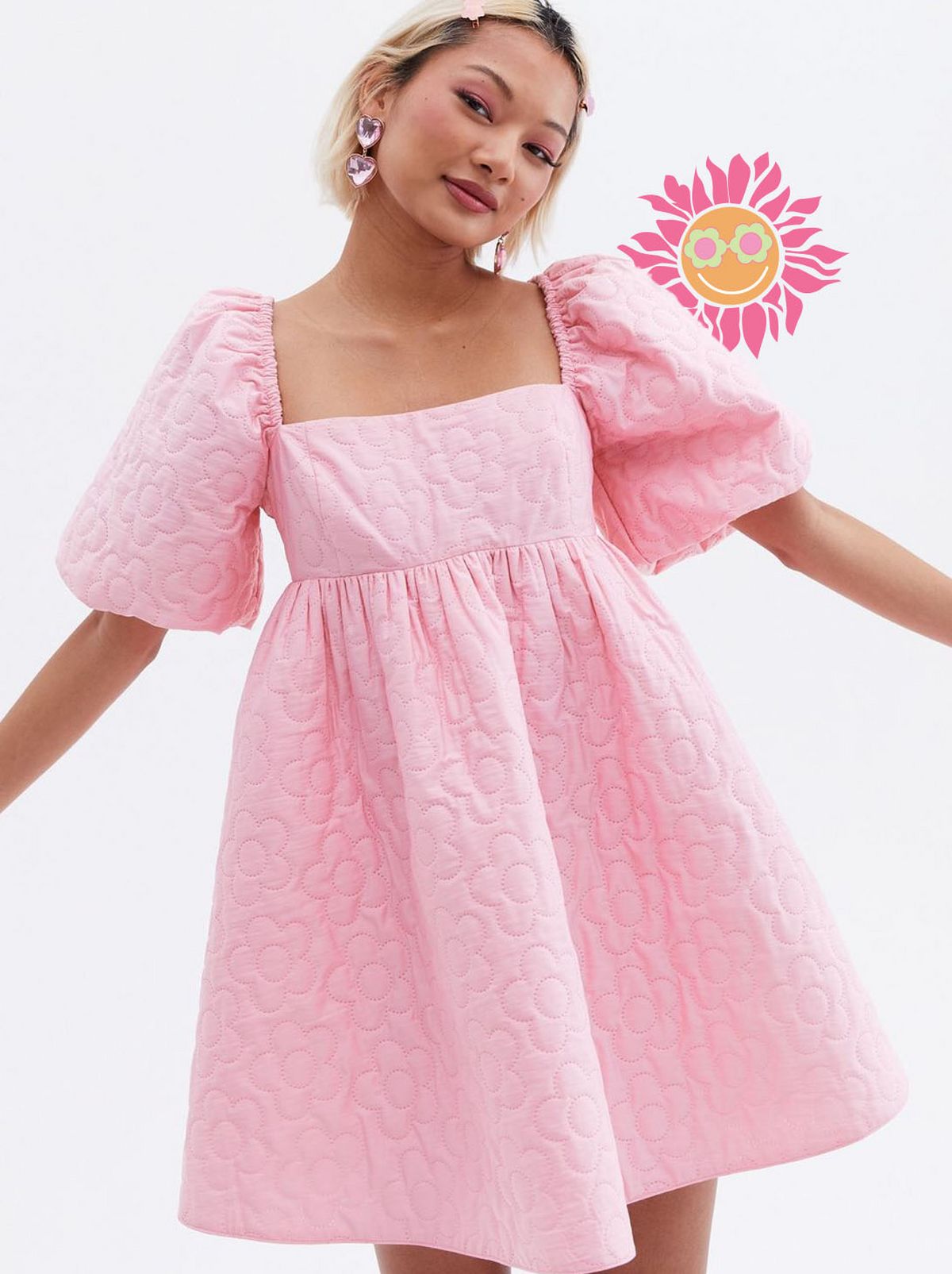 Woman wearing a pink puff sleeve mini dress