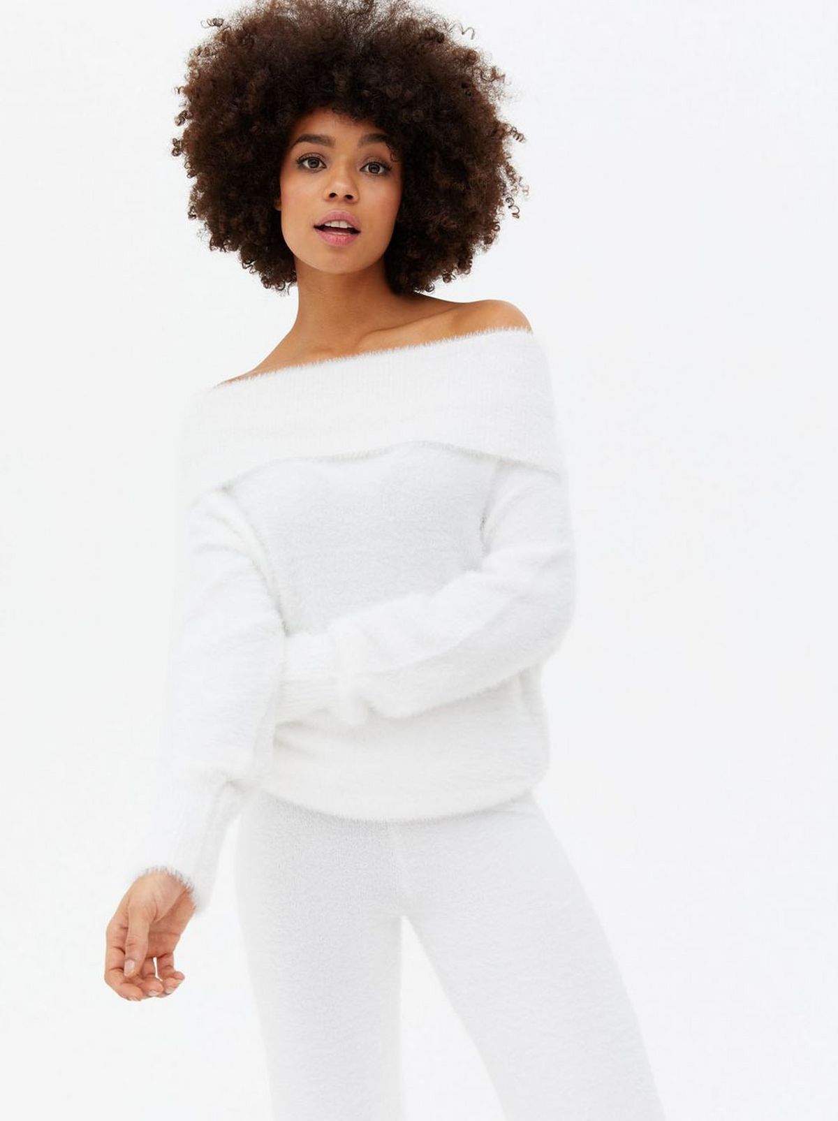 Woman wearing a fluffy knit bardot jumper