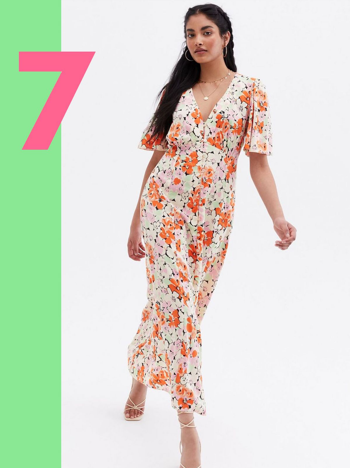 Woman wearing an orange floral button front midi dress