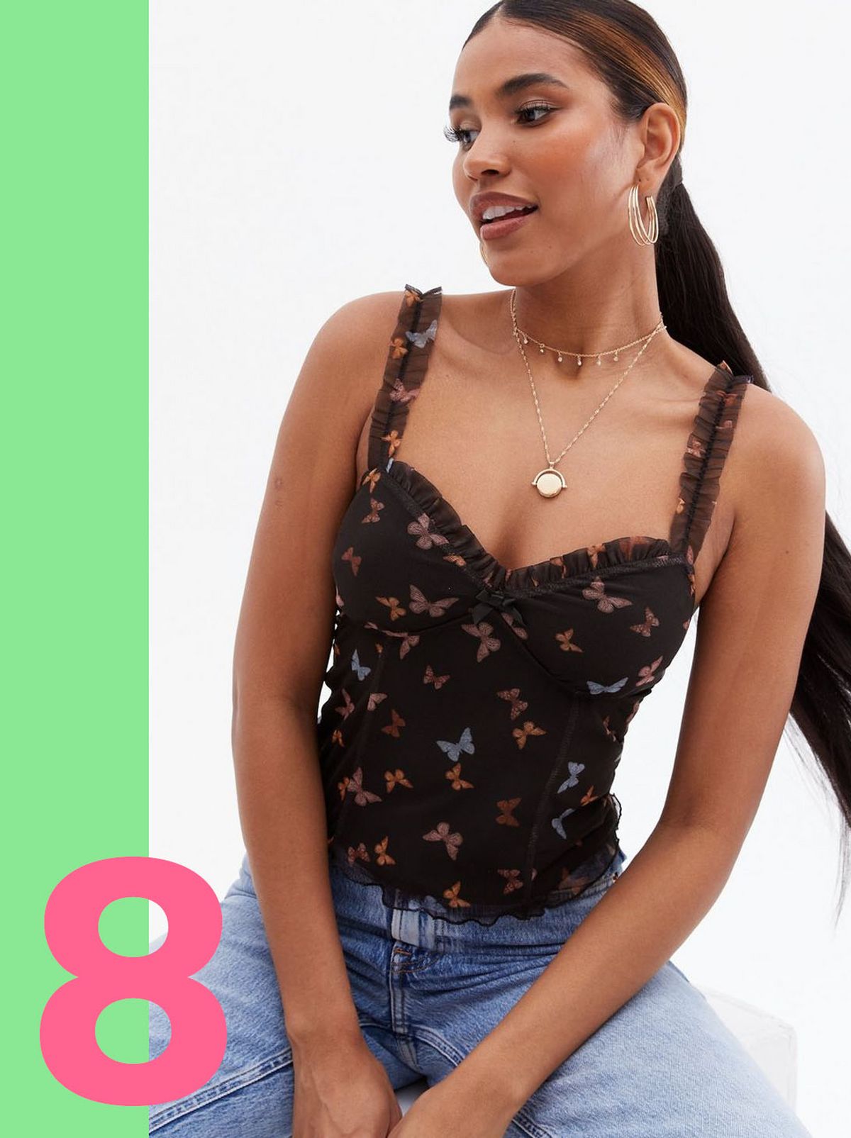 Woman wearing a black butterfly mesh frill cami