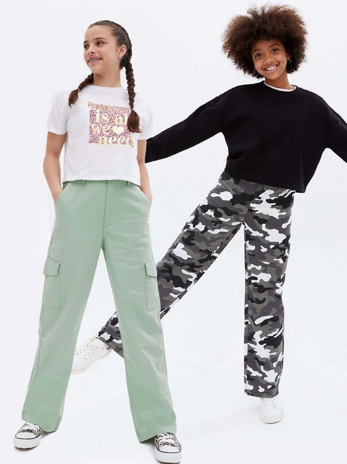 Girl wearing light grey cargo trousers, Girl wearing military print cargo trousers