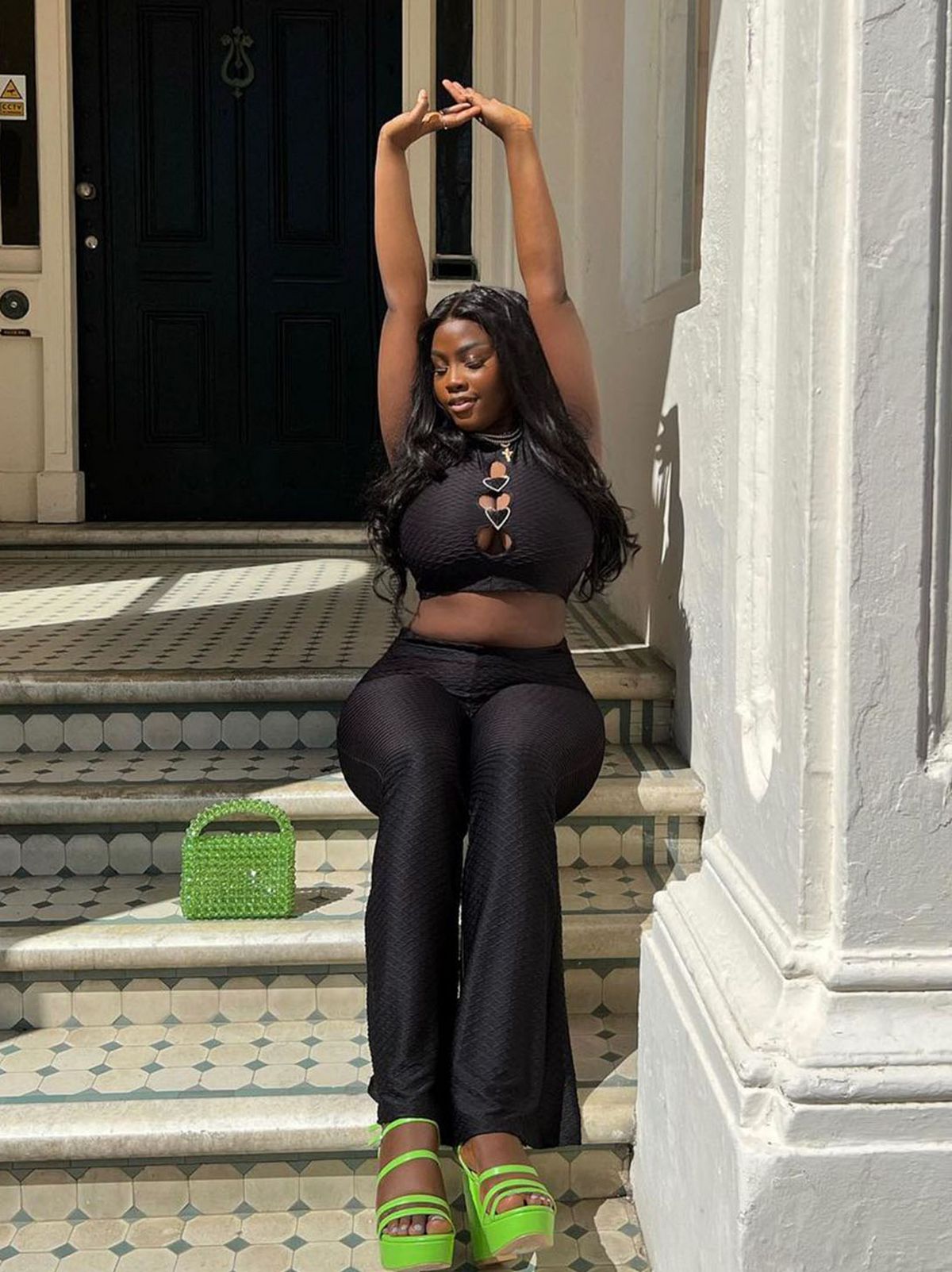 @sumboowoyele wearing an Anne-Marie black co-ord set
