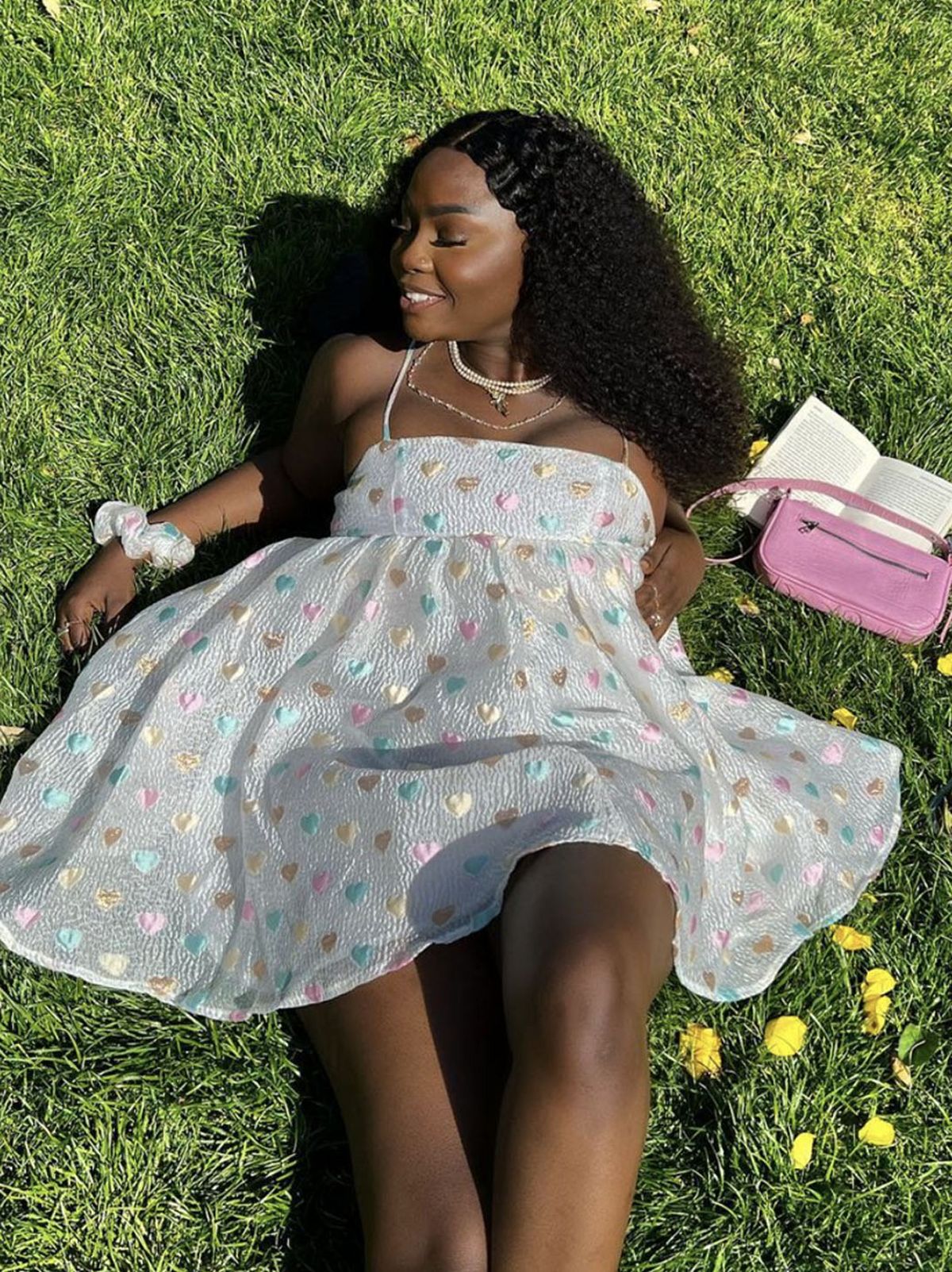 @sumboowoyele wearing an Anne-Marie grey dress