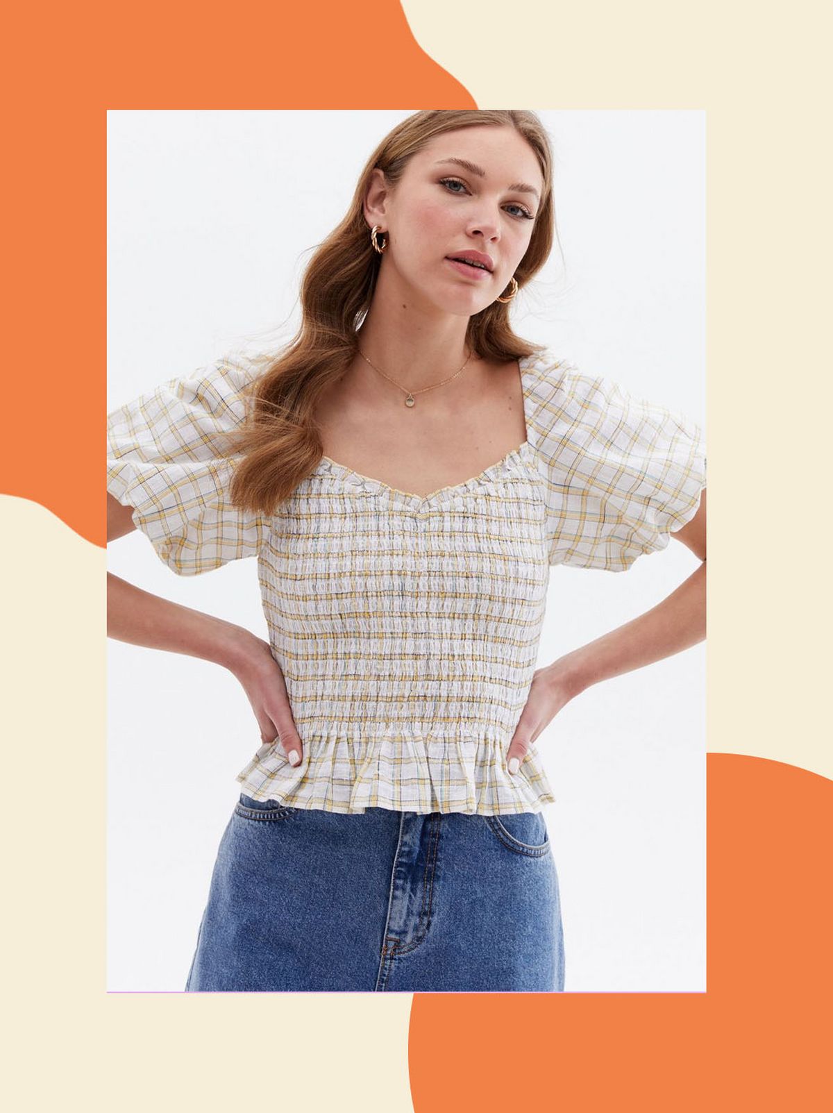 Woman wearing a white check puff sleeve peplum blouse