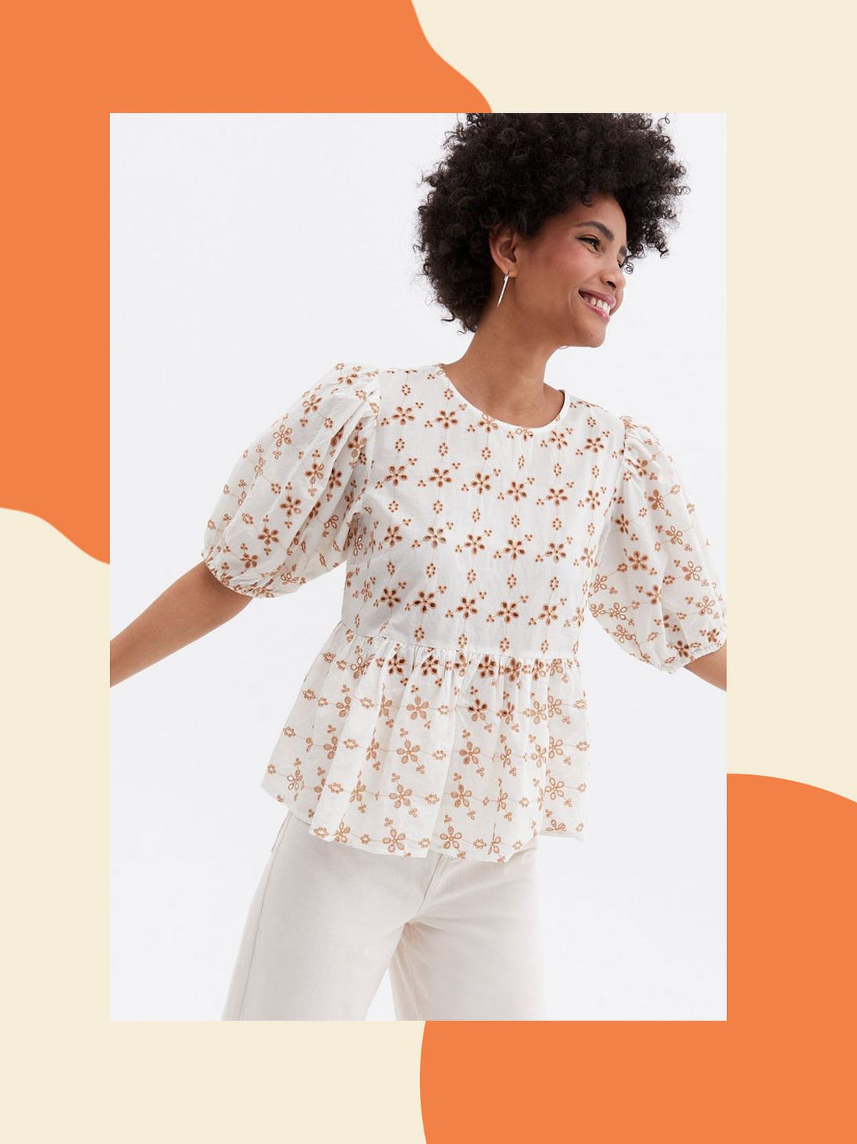 Woman wearing a rust floral broderie peplum top