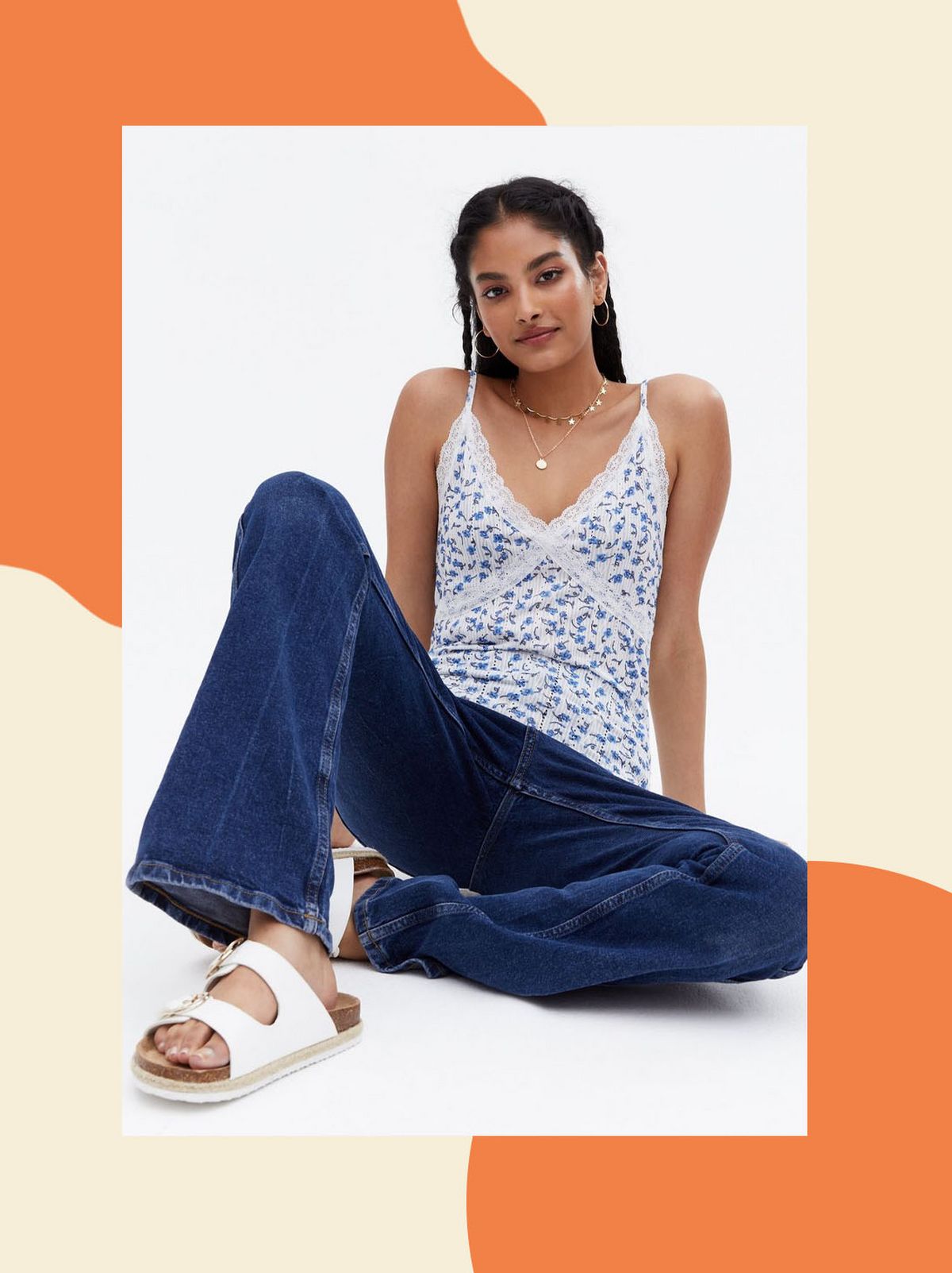 Woman wearing a blue ditsy floral lace trim cami