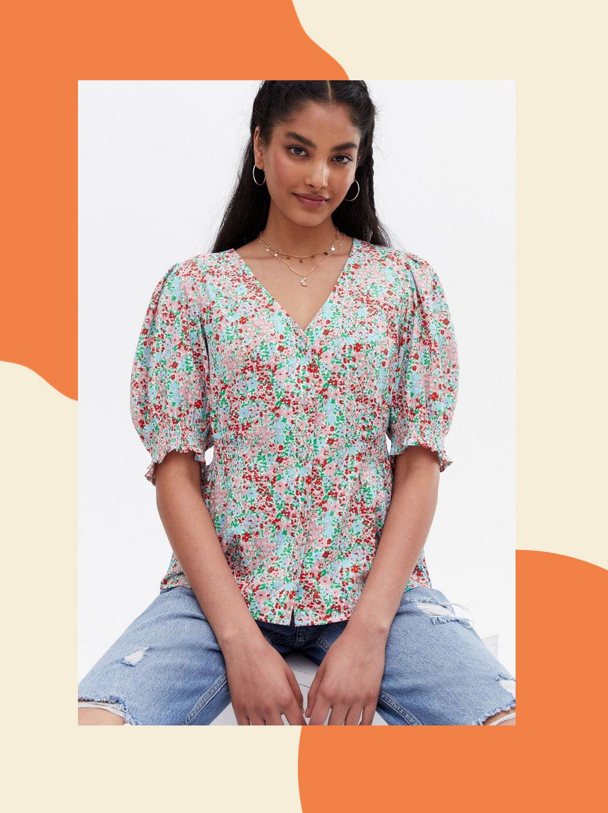 Woman wearing a blue ditsy floral puff sleeve blouse