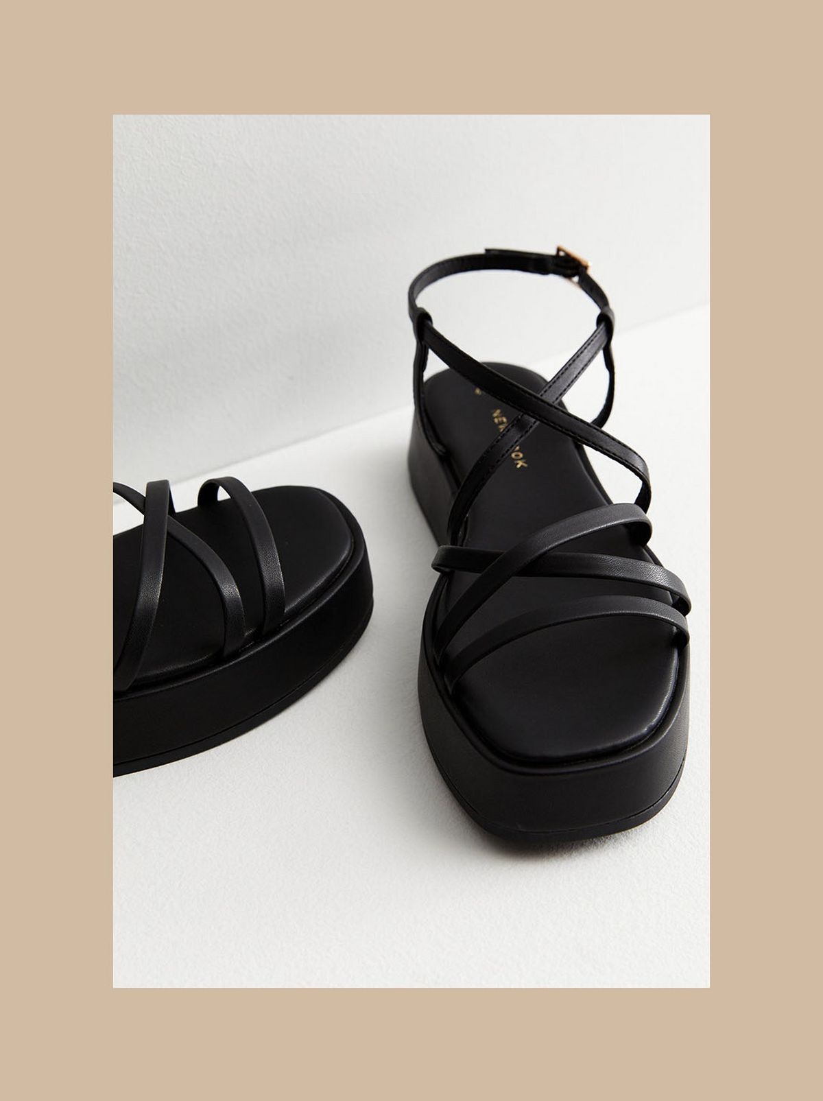 Women’s black strappy flatform sandals