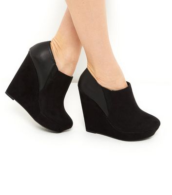 black wedge shoe boot