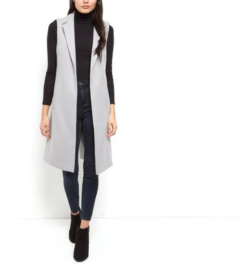 grey sleeveless jacket