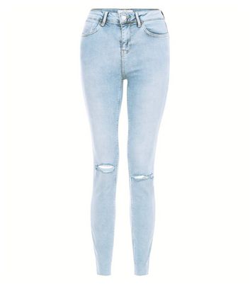 light blue ripped knee jeans