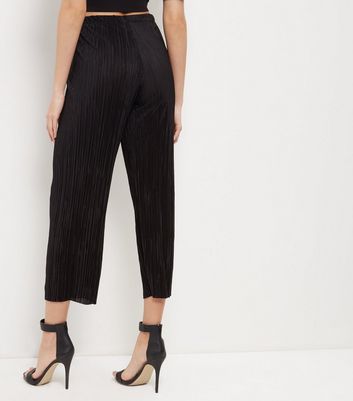 black pleated cropped trousers