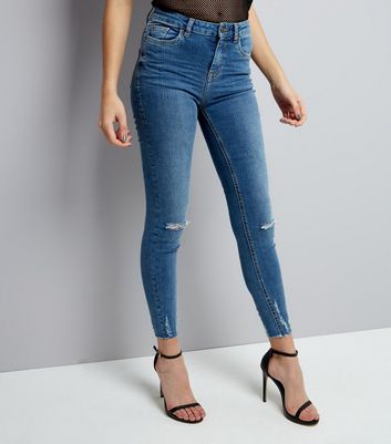 blue ripped hem skinny jeans