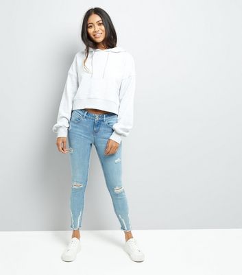 petite blue ripped skinny jeans