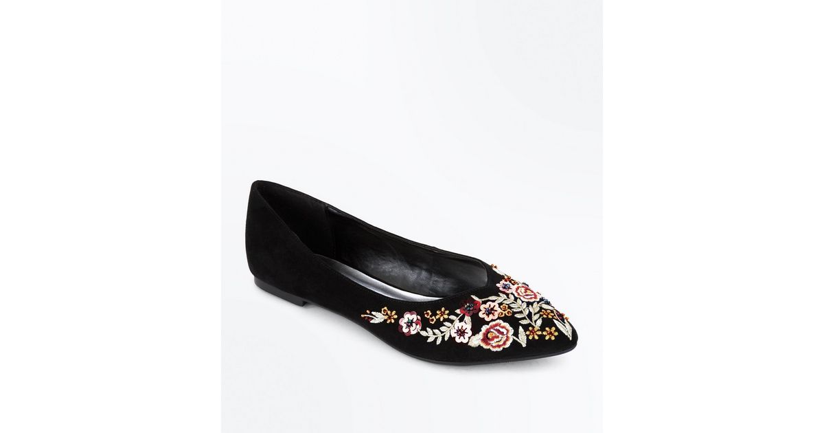 black floral pumps